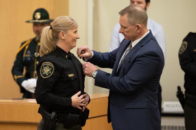   Oregon Supreme Court Justice Adrienne Nelson issued the oath of office while  Morrisey O’Donnell’s husband, retired Multnomah County Sheriff’s Deputy Bob O’Donnell, pinned on her Sheriff’s badge.  