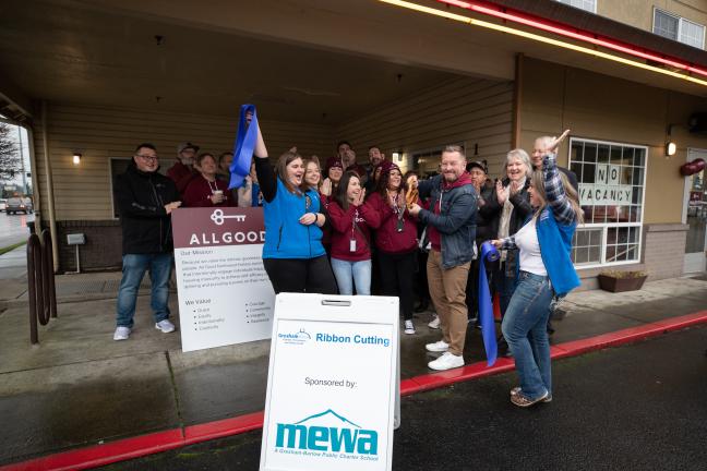 Staff and board members with All Good Northwest, and members of the Gresham Chamber of Commerce, cut the ribbon for the Rockwood Bridge Shelter on Jan. 13, 2022.