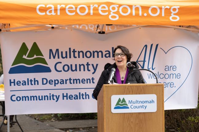 A photo of Multnomah County Chair Jessica Vega Pederson speaking at a podium