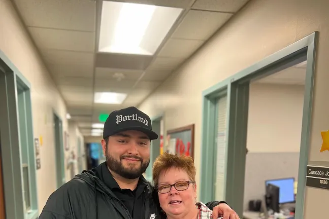 Recently, Justus Sanchez (left) felt called to go back to the Juvenile Services Division — over a decade after the original incident — and visit with the juvenile court counselor who believed in him.