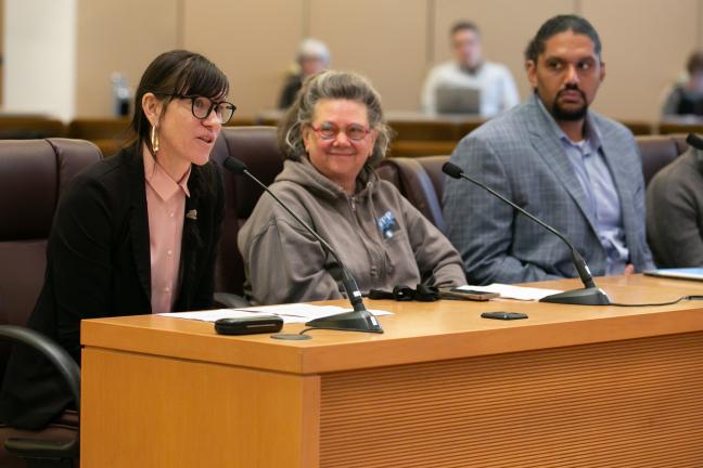 Photo of Molly Hogan, Laura Golino de Lovato, Joshua Bates and Cole Merkel sitting at a dais.