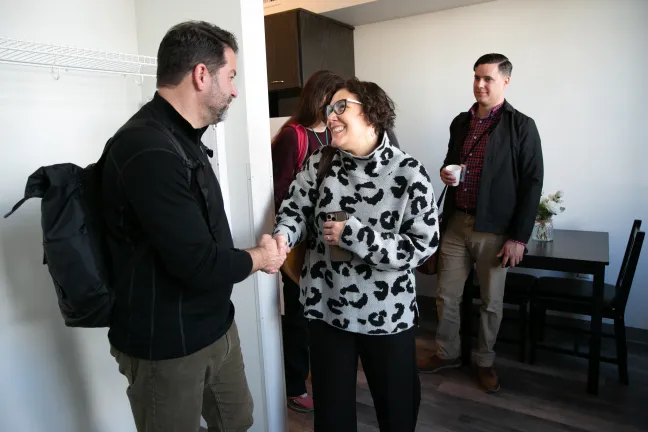 Multnomah County Chair Jessica Vega Pederson shakes hands with Jeff Olivet from USICH