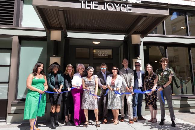 Ribbon-cutting in front of the Joyce building.