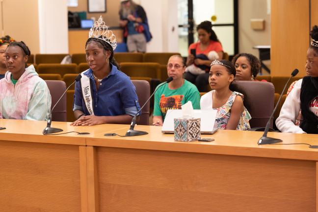 Four participants with the Mr. and Miss Juneteenth Program and Pageant spoke with the Board. Princess Fletcher (second from left)  who was crowned Ms. Juneteenth Oregon 2023, recited an original poem. 