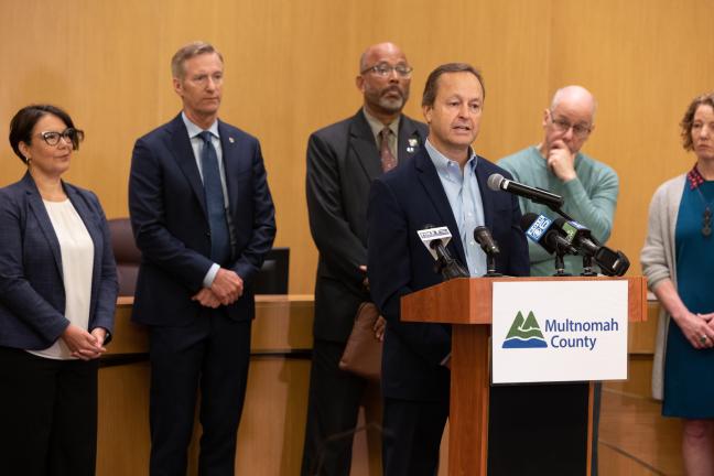 Dan Field stands at the dais in Multnomah County board chambers