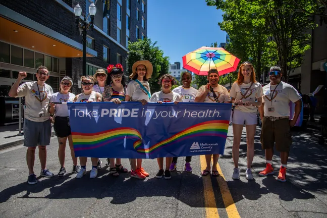 Multnomah County leadership and staff march in the Pride parade