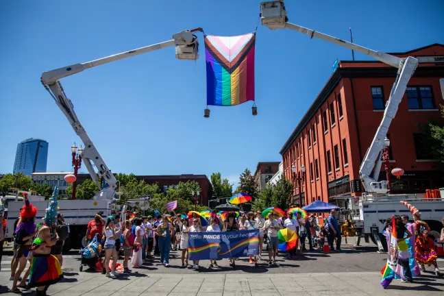 Multnomah County leadership and staff march in the Pride parade
