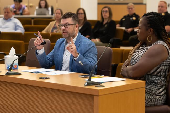 Jay Scroggin, (center) director for Multnomah County’s Department of Community Justice Adult Services Division, described how uncertain and insufficient funding impacts parole, probation, caseloads and other related services.