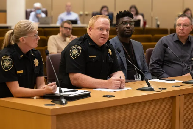 Multnomah County Sheriff's Office Corrections Facilities Chief Deputy Stephen Reardon (second from left) speaks to board. 