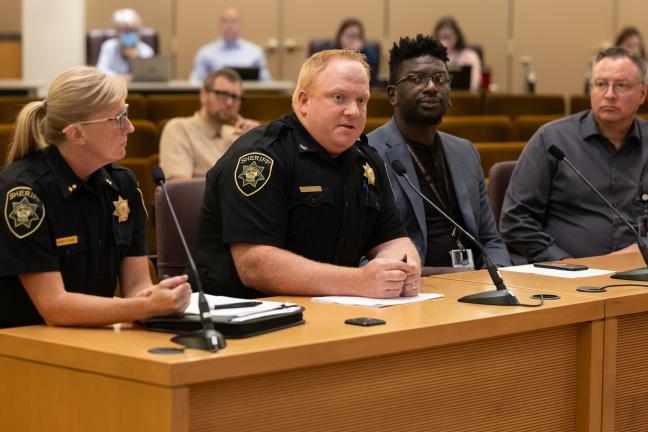 Multnomah County Sheriff's Office Corrections Facilities Chief Deputy Stephen Reardon (second from left) speaks to board.