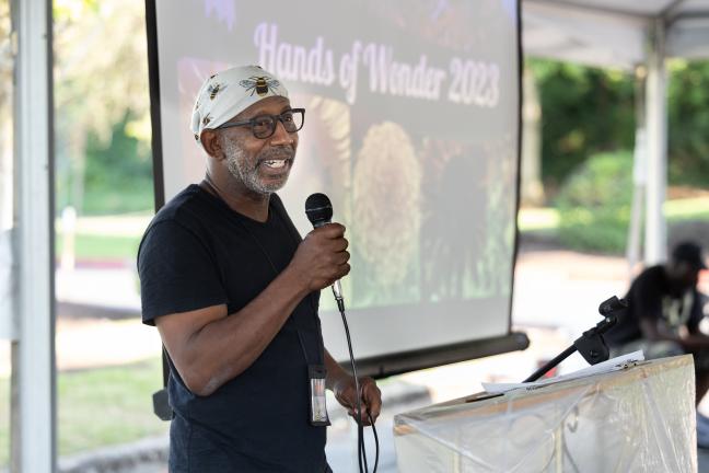 Jerry Hunter, the HOW garden program and employment coordinator, addressed diners Saturday and acknowledged the effort and work that goes on behind the scenes to make it all possible.