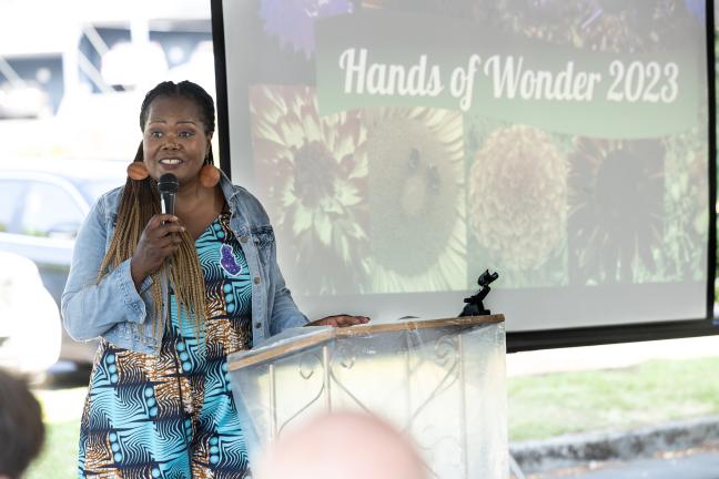 Department of Community Justice Director Erika Preuitt speaks to guests at Farm to Table dinner.