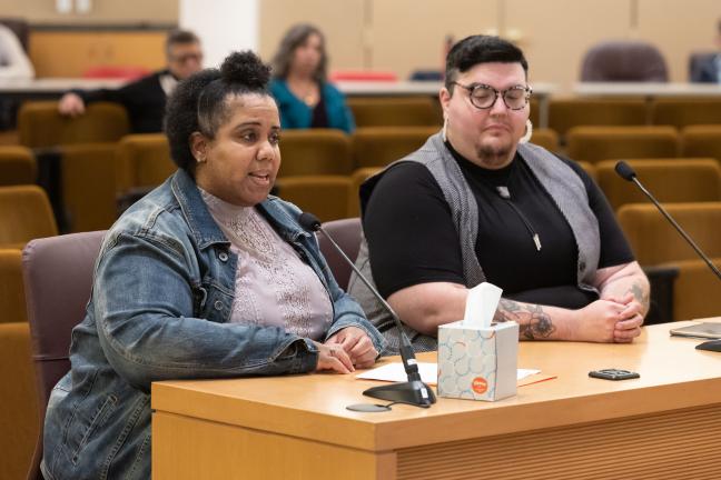 Panelists speak to the Board of Commissioners for the 2023 Domestic Violence Awareness Month proclamation