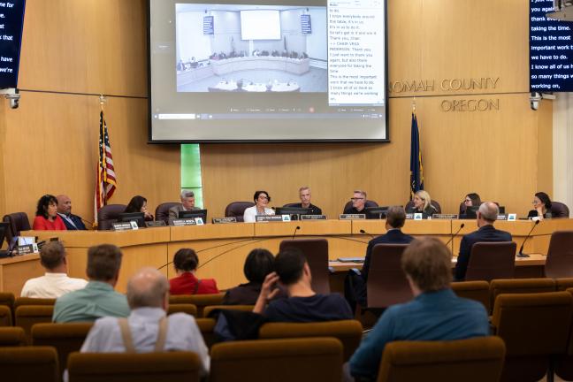 Ten City and County elected officials sit at the dais in the County boardroom