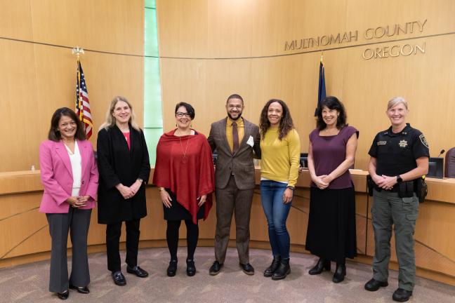 From left: former Commissioner Susheela Jayapal, Commissioner Julia Brim-Edwards, Chair Jessica Vega Pederson, Commissioner Jesse Beason, Commissioner Beason's sister, Commissioner Sharon Meieran, Sheriff Nicole Morrisey O'Donnell