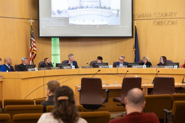 Photo of City Council and County Commission members sitting at the dais in the Multnomah County boardroom.