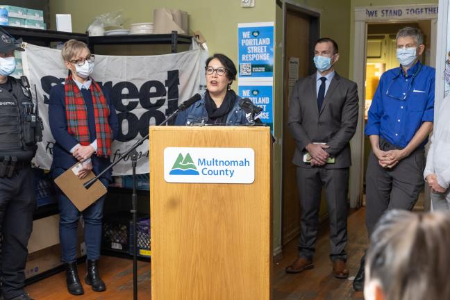 Chair Jessica Vega Pederson stands at the dais.