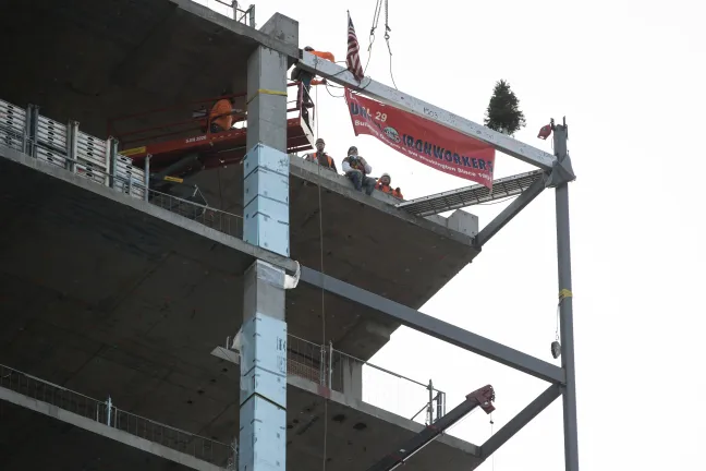 The final beam was lifted from the sidewalk on SW First Ave. up to the southwest corner of the 17th floor where it will remain a part of the building.