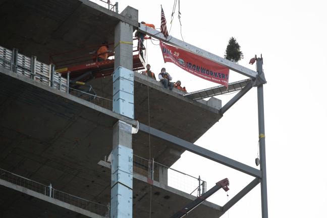 The final beam was lifted from the sidewalk on SW First Ave. up to the southwest corner of the 17th floor where it will remain a part of the building.