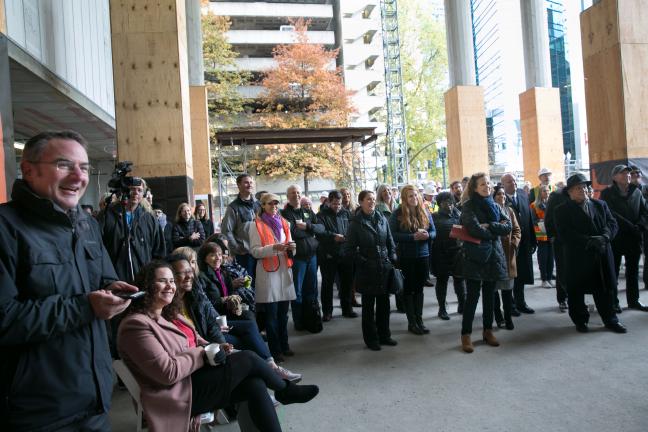 Hundreds of people gathered in the lobby of the Central Courthouse Project for Topping Out ceremony
