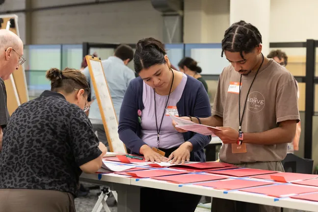 Participants — including Elections and City of Portland staff — sort and count sample ballots July 28, 2024, as part of a test hand recount at Multnomah County Elections.