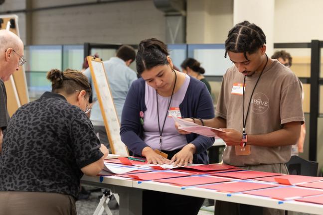 Participants — including Elections and City of Portland staff — sort and count sample ballots July 28, 2024, as part of a test hand recount at Multnomah County Elections.