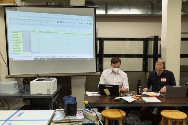 Adrian Austin-King and Daniel Eisenbeis of Multnomah County Elections compile counts of sample ballots July 28, 2024, as part of a test hand recount.