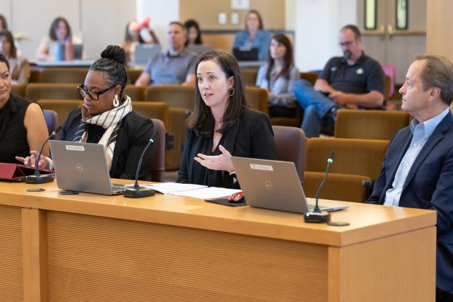 Kanoe Egleston, Antoinette Payne, Anna Plumb and Dan Field sit at the dais.