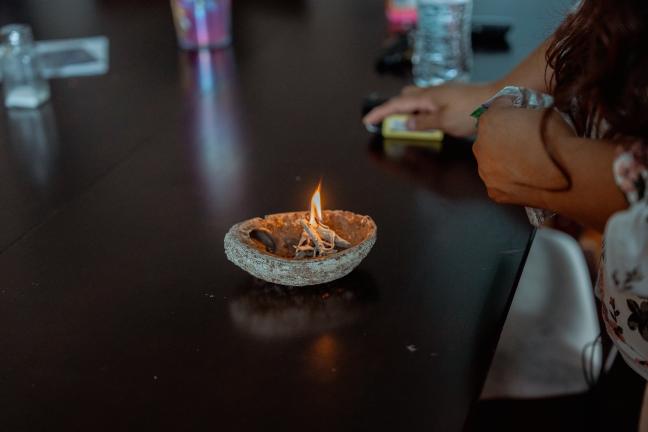 Sage burning in an abalone shell