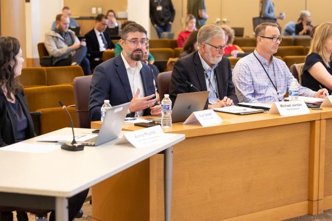 Presenters representing the Homelessness Response System at the dais of the Multnomah County boardroom