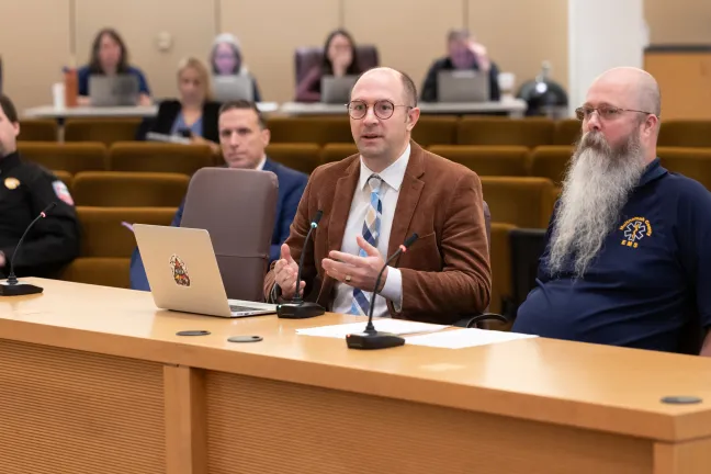 Health Officer Dr. Richard Bruno (left) and Health Officer Operations Manager Aaron Monnig speak to the Board