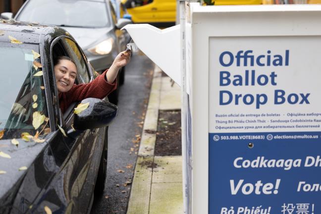 A voter drops off their ballot on Nov. 5, 2024. 