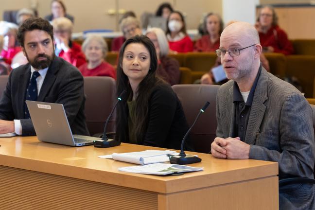 Sustainability Director John Wasiutynski, Cristina Nieves, District 1 policy advisor, and Emergency Management Director Chris Voss address the Board.