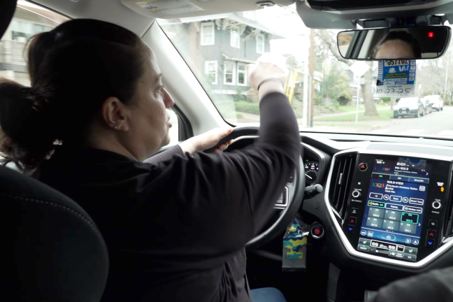 Outreach worker driving in car