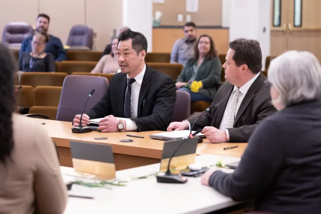 Jun Zhu, a senior procurement analyst for the County, and Brian Smith, the County’s purchasing manager, present the Procurement Month in Multnomah County proclamation. Wednesday, March 19, 2025.