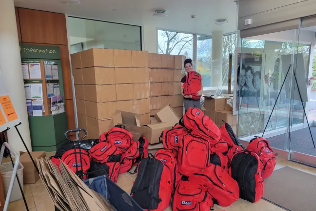 County employee holds one of dozens of emergency preparedness kits distributed over the past year