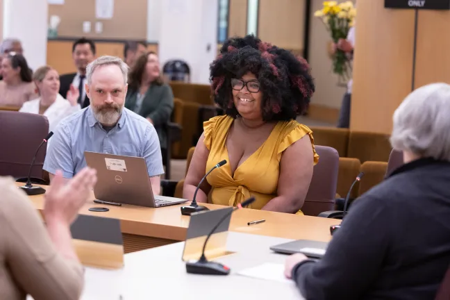 Quinn Colling, chief of staff for Commissioner Shannon Singleton, and Salomé Chimuku, policy advisor for Singleton, present the Women’s History Month in Multnomah County proclamation. Wednesday, March 19, 2025.