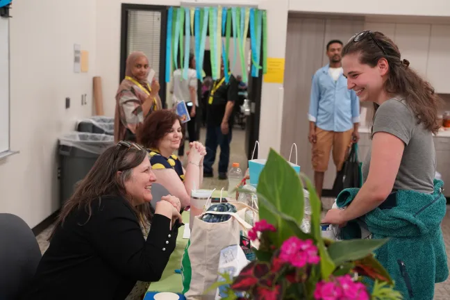Attendees smile at the Intellectual and Developmental Disabilities Information Fair in 2024.