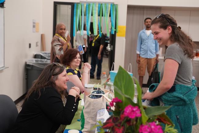 Attendees smile at the Intellectual and Developmental Disabilities Information Fair in 2024.