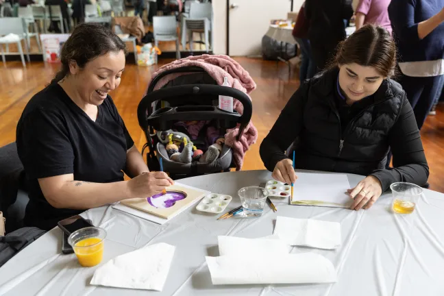 Families paint at a WIC sponsored art class