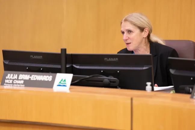Commissioner Julia Brim-Edwards sits behind the dais during the June 12, 2025, board meeting.