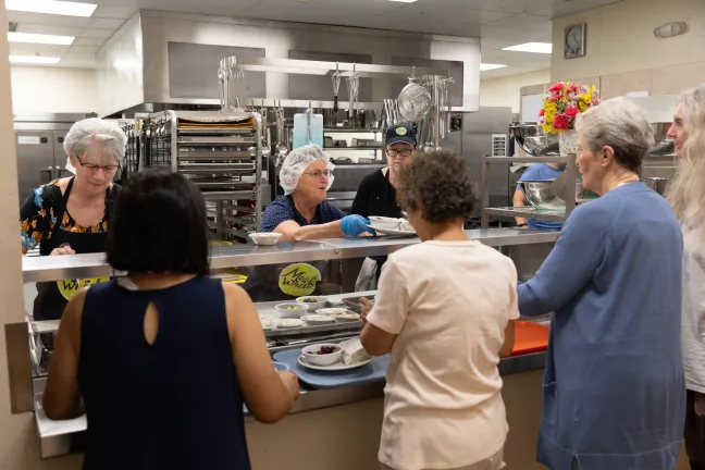 Meals on Wheels People serving guests at their site in Gresham. The site is connected to the Gresham Senior Center, located in the Multnomah County Health Building at 600 N.E. Eighth Street.
