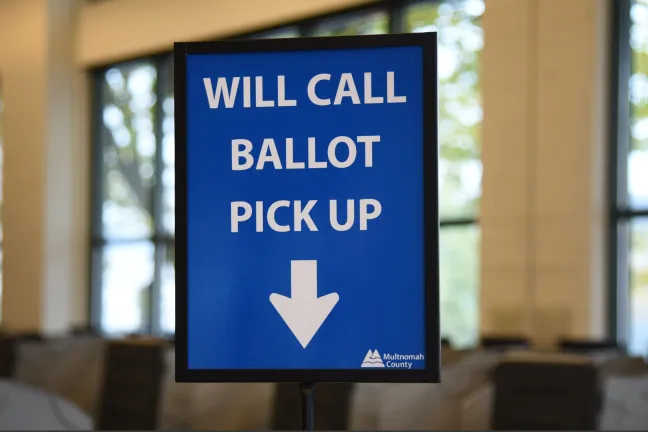 signage in elections office reading will call ballot pick up 
