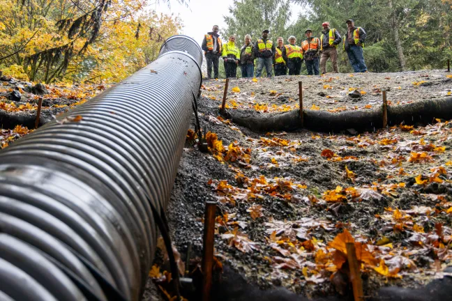 Large culvert photographed close-up, running up the slope before installation