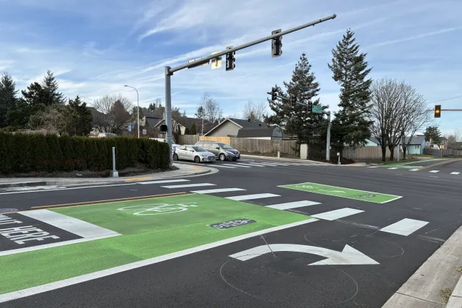 Green bike box painted in front of intersection