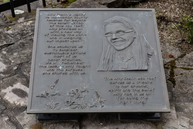 Plaque reads “Amy Joslin’s legacy to Multnomah County reaches far beyond the construction of this eco roof. Amy provided all with a new way of viewing the world and in weighing our impact upon it. She educated us to consider sustainable options most of us never dreamed. We will remember the lessons Amy taught and the purpose she shared with us. The Amy Joslin eco roof serves as a tribute to her dreams, spirit and the belief Amy had in us all for doing the right thing.”