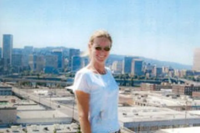 Amy Joslin posing on the Multnomah Building eco roof