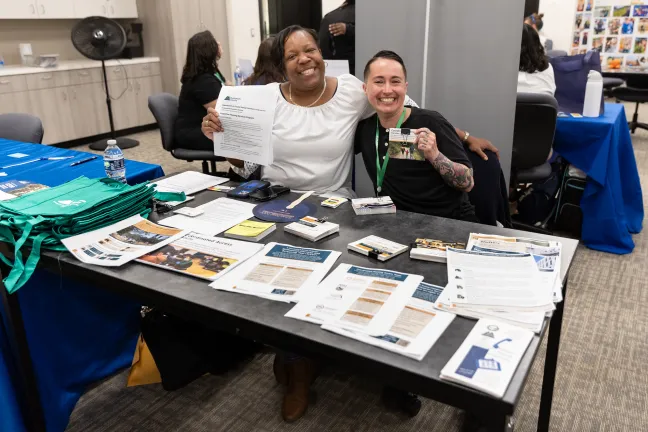 Two staff at the Information Fair
