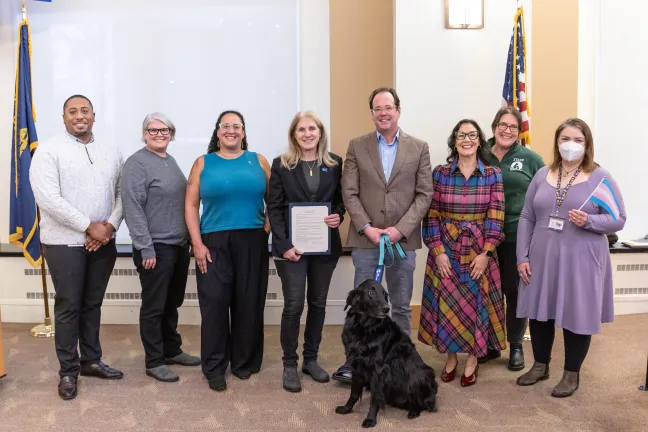 Board of Commissioners and community members pose for a photo