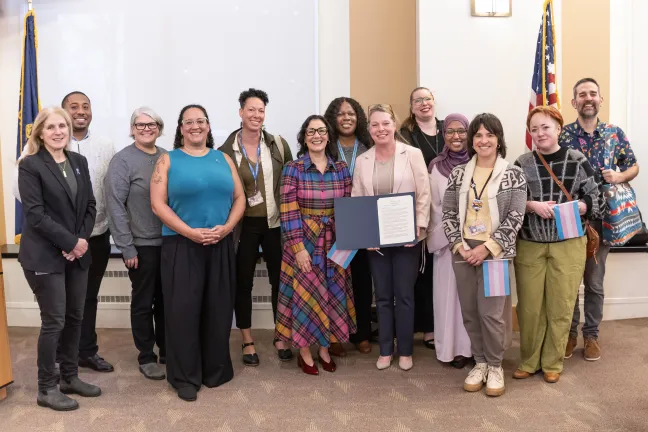 Board of Commissioners joined by community members and advocates during a board meeting.